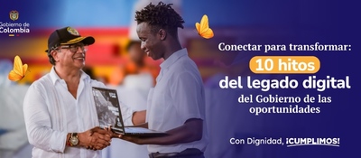 Estatua frente a edificios públicos y bandera de Colombia ondeando bajo cielo azul, símbolo de transformación digital.